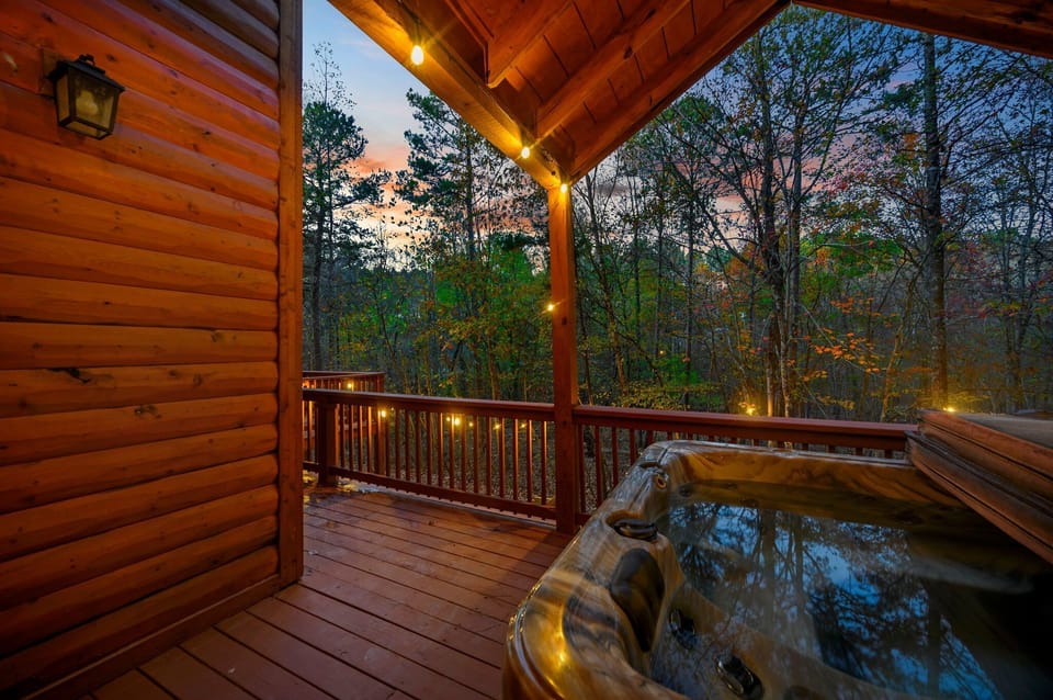 Hot tub on the covered deck seats 4-6, has jets/lights and forest views
