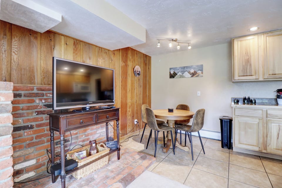 Living area features a large TV.
