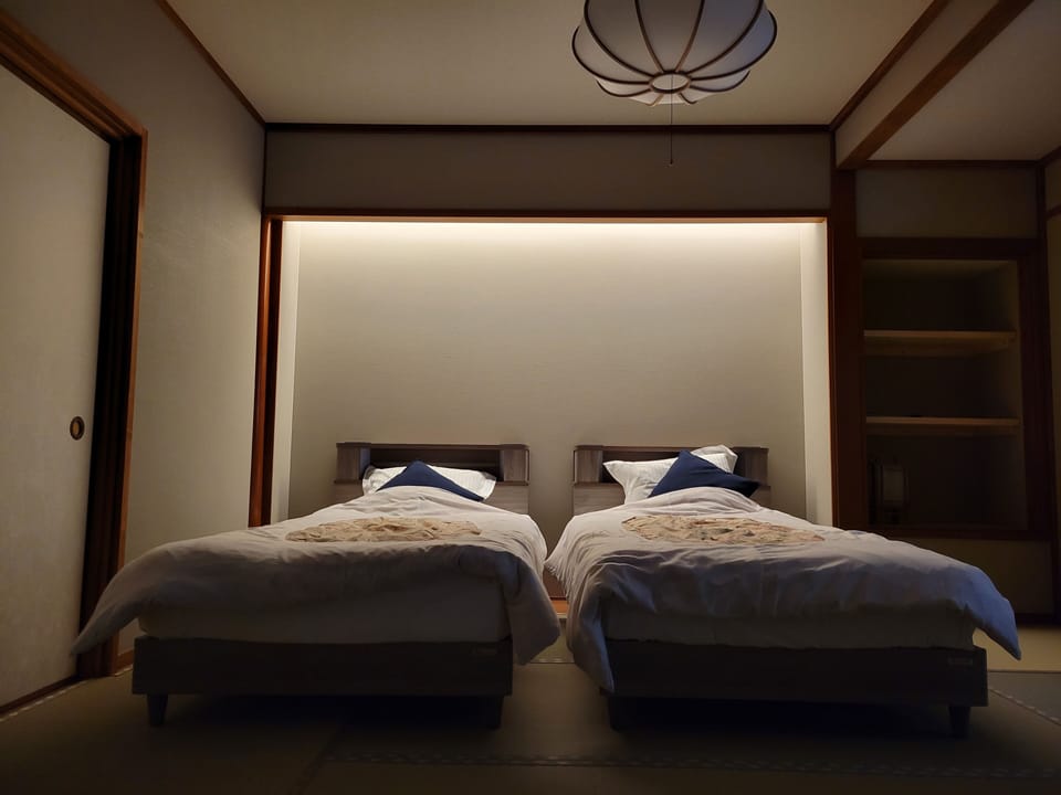 Deluxe Twin Room, 2 Twin Beds, Non Smoking, Shared Bathroom | In-room safe, blackout drapes, WiFi (free), bed sheets