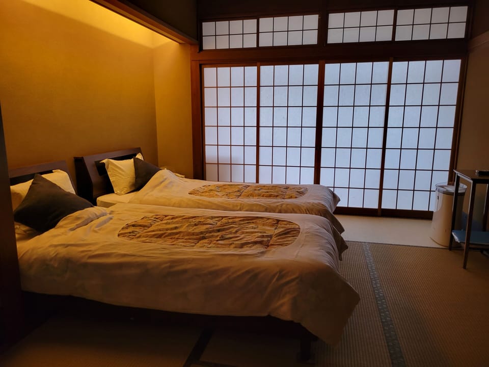 Basic Twin Room, 2 Twin Beds, Non Smoking, Shared Bathroom | In-room safe, blackout drapes, WiFi (free), bed sheets