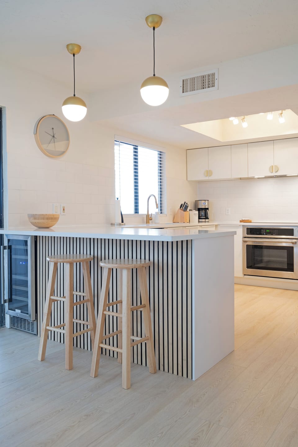 Modern kitchen with all the essentials. Filtered water, drip coffee, wine fridge