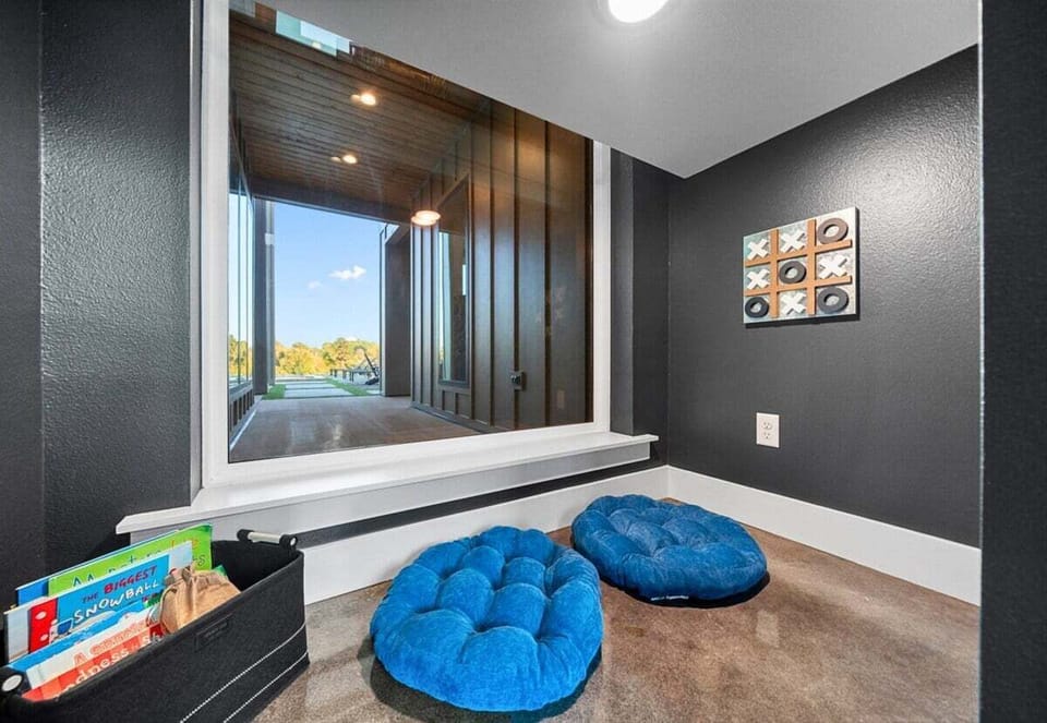 This cozy corner is a haven for quiet moments and relaxation with a book under the stairs for the kids!