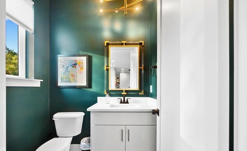 This charming half bath brings modern style to a small space, making it perfect for guests and quick refreshes.