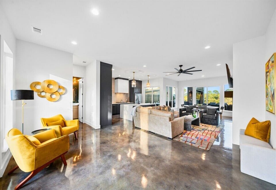 This open and welcoming space flows naturally, with cozy corners and plenty of room for everyone to enjoy and unwind.