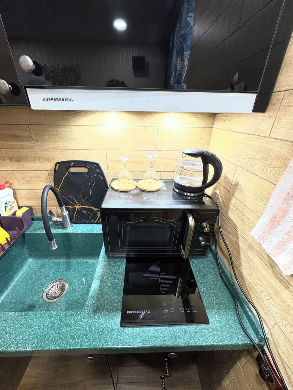 Modern kitchen with appliances – perfect for cooking or brewing coffee.