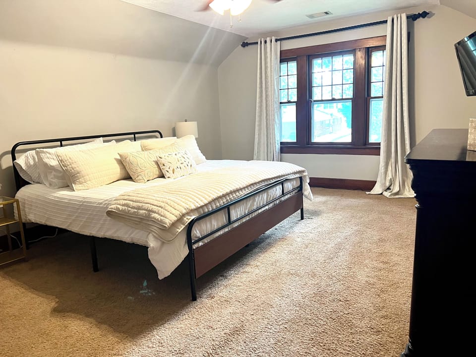 Master Bedroom with king bed, dresser and TV for storing and watching!