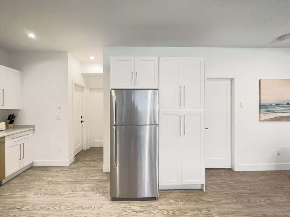 Full size refrigerator in the kitchen.