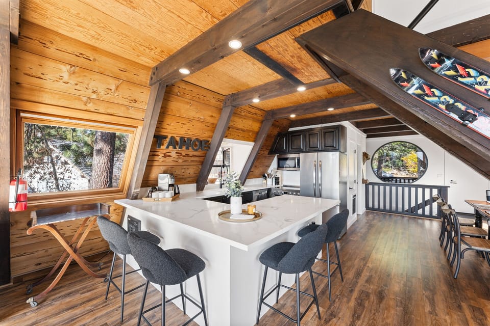 A chef's delight! The gourmet kitchen features sleek countertops, state-of-the-art appliances, perfect for meal prep or casual dining. Seating for 4 around the kitchen. A drip coffee maker is provided. 