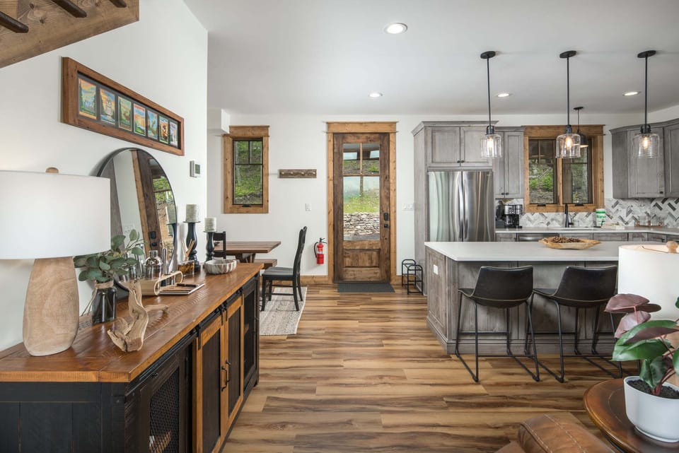Spacious main-level gathering space with a well-equipped kitchen and mountain lodge design