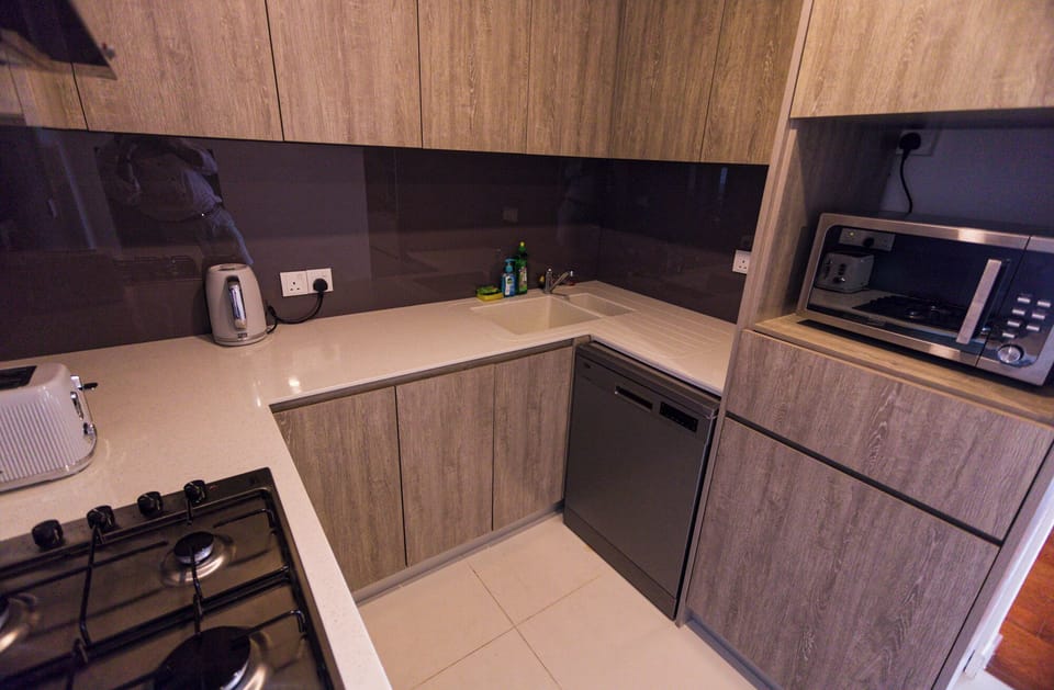 Fully fitted kitchen with a microwave.