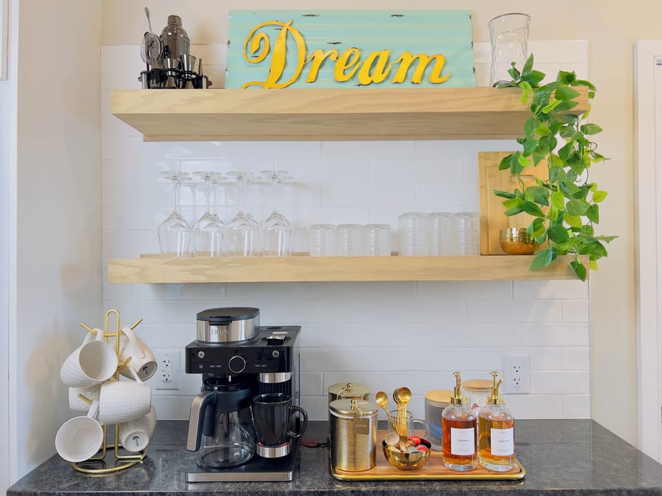 Fully equipped coffee bar with ground coffee and nespresso pods. 