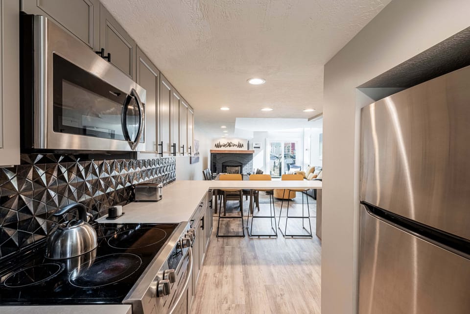 Fully Equipped Kitchen with counter seating