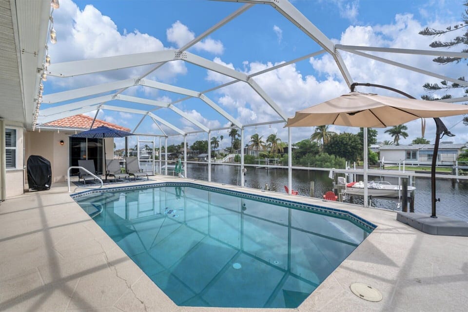 Sparkling pool overlooking canal.
Pool os 26' x 14' x 6'D