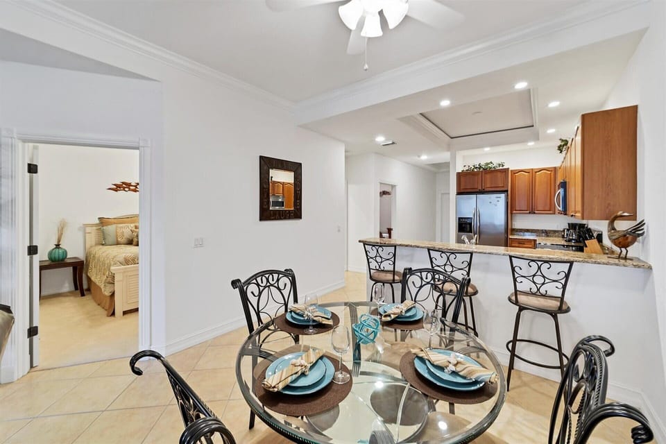 Dining table seats 4 while kitchen island seats another 3