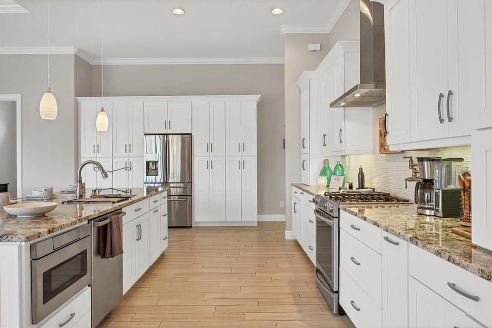 Gorgeous, bright, fully-equipped kitchen with stainless steel appliances, gas range, and plenty of storage &amp; countertop space. Kitchen island seats 6