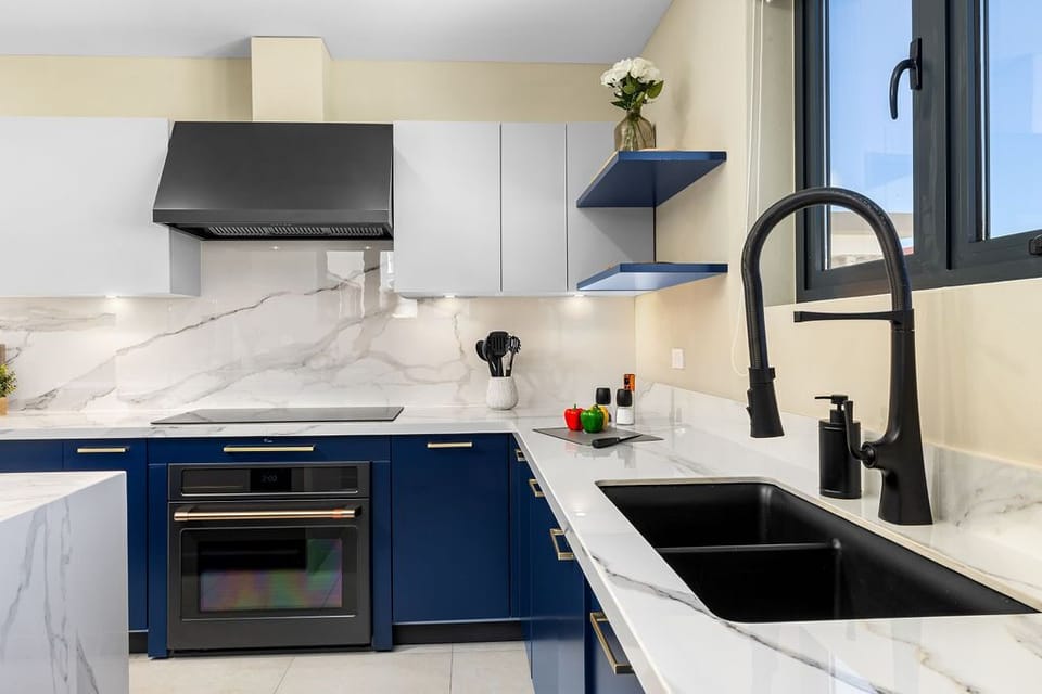 Cook up a feast in the fully equipped kitchen featuring high-end appliances, a central island, and all the essentials for creating delicious meals for your group