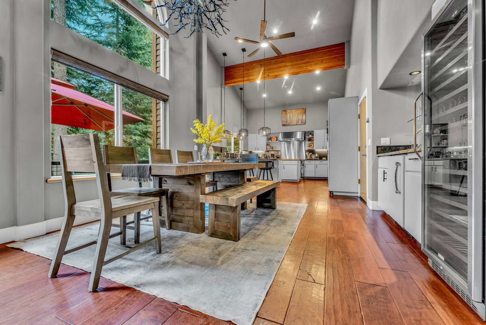 Dining Room: 6-person dining table, bar area, large wine fridge, adjacent to kitchen and living room