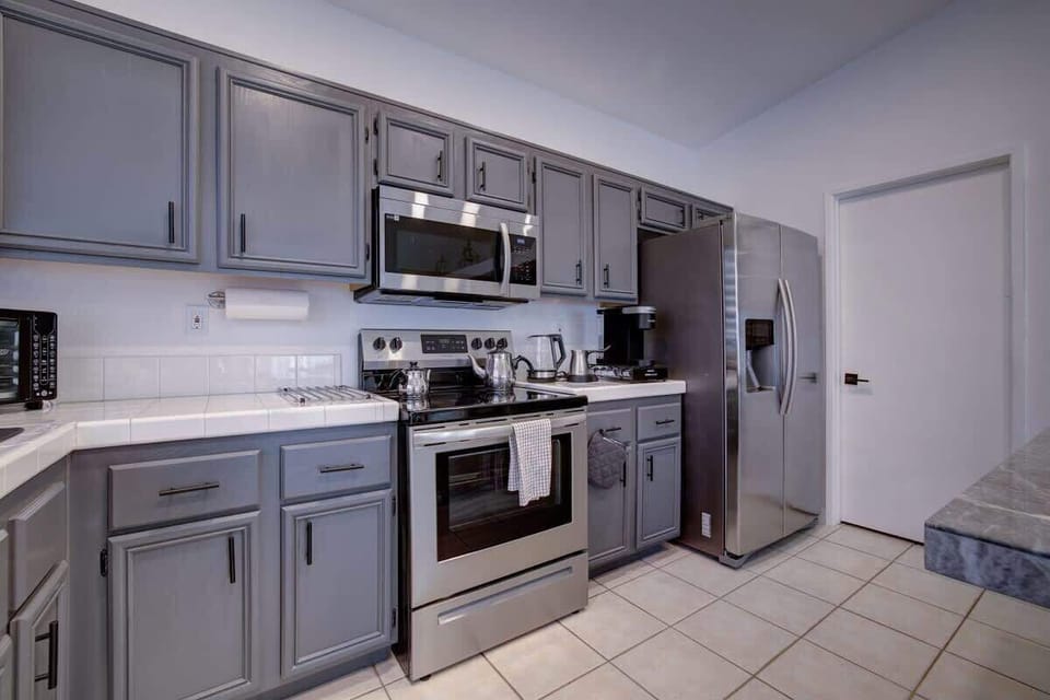 Open kitchen layout with plenty of counter space for meal prep