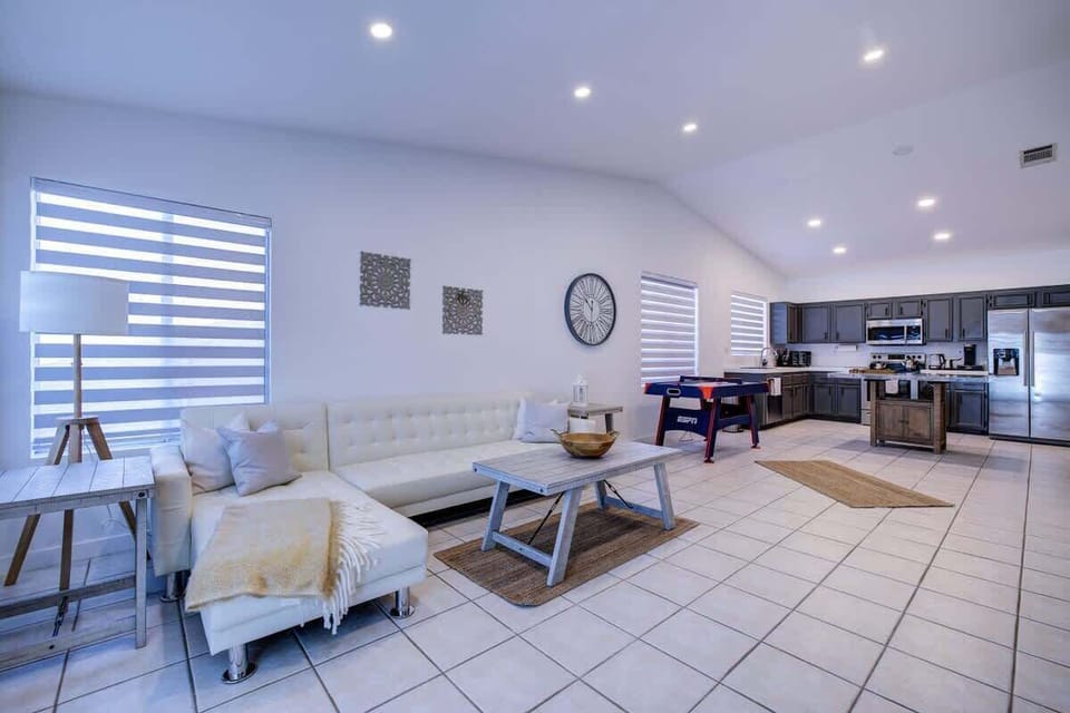 Open-concept living area with natural light and clean design