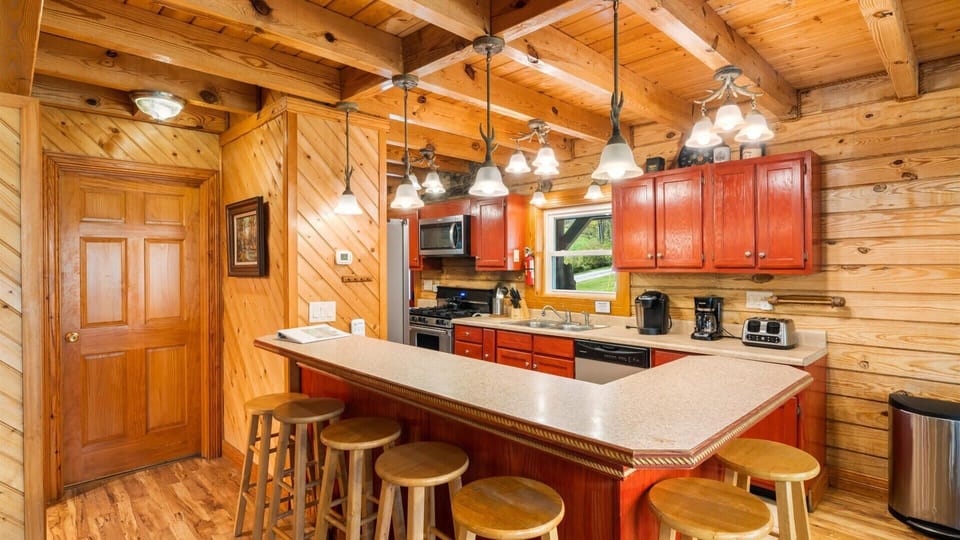 Cook, gather, and enjoy—our fully stocked kitchen features a spacious island with plenty of seating.