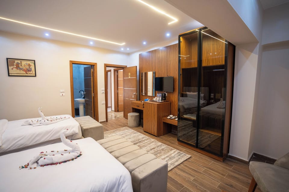 Deluxe Double or Twin Room | Minibar, individually decorated, desk, blackout drapes