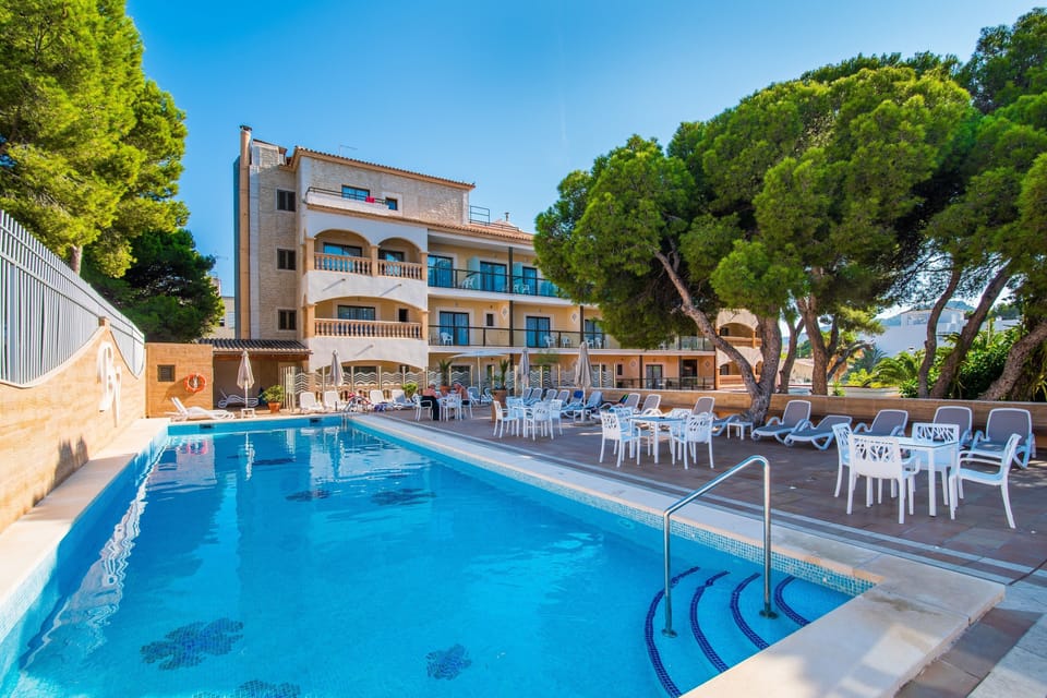 Outdoor pool, a rooftop pool, open 7:30 AM to 8:00 PM, pool umbrellas