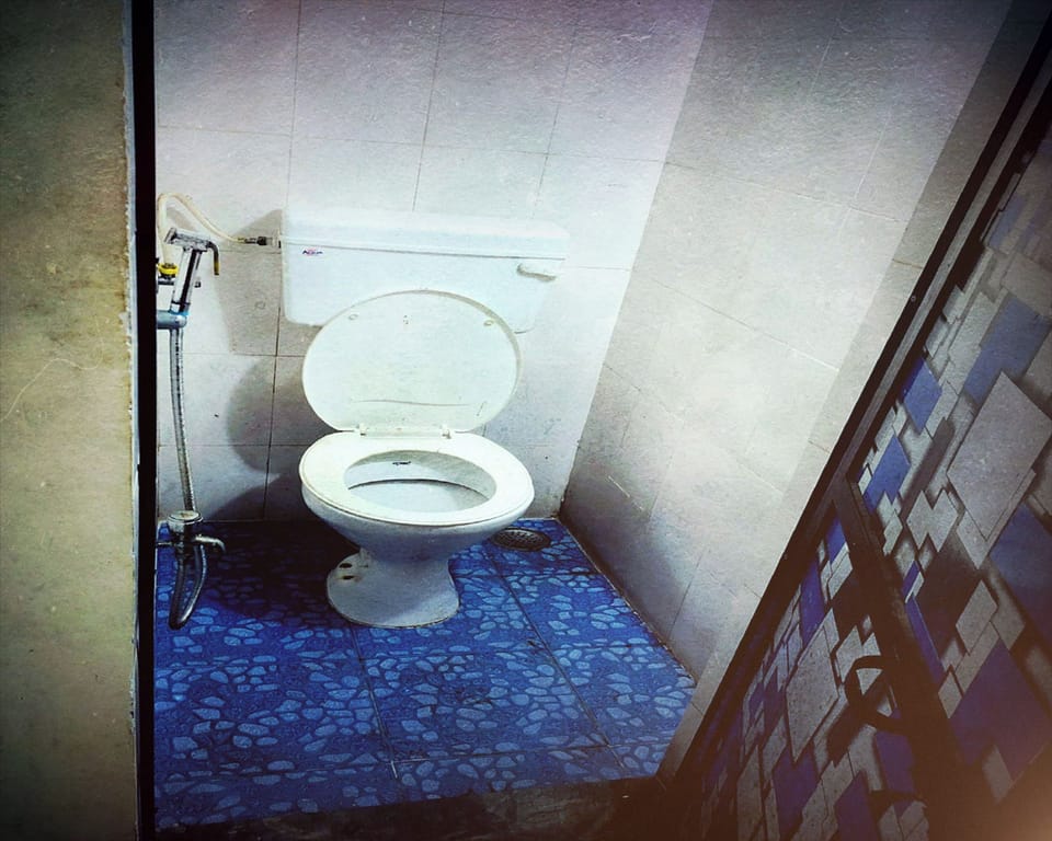 Basic Shared Dormitory | Bathroom | Shower, towels, soap, shampoo