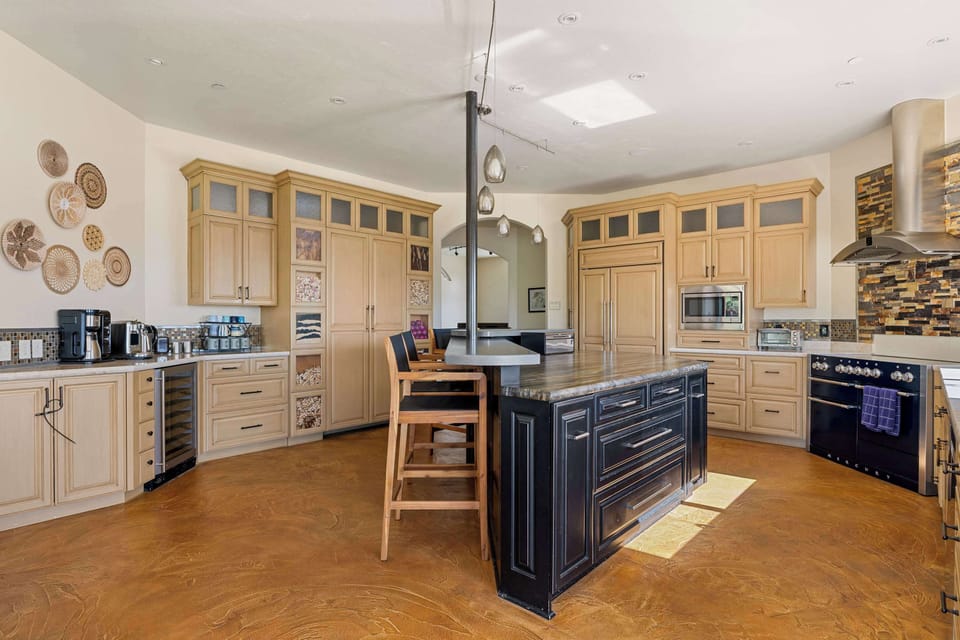Bar seating in the kitchen invites conversation and connection while meals are prepared.