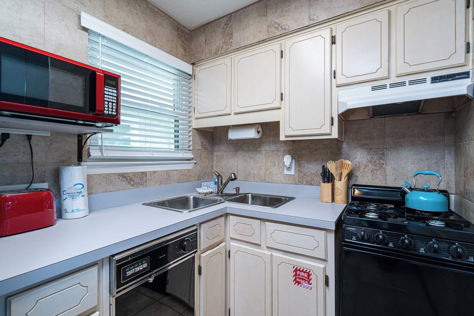 The open, airy kitchen offers ample space & all the comforts of home
