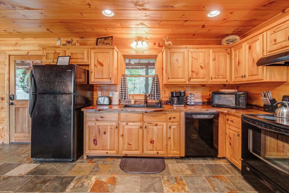 The fully-equipped kitchen is spacious & offers all the comforts of home