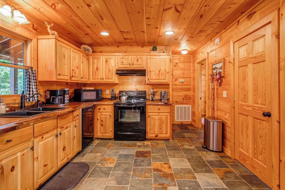 The fully-equipped kitchen is spacious & offers all the comforts of home