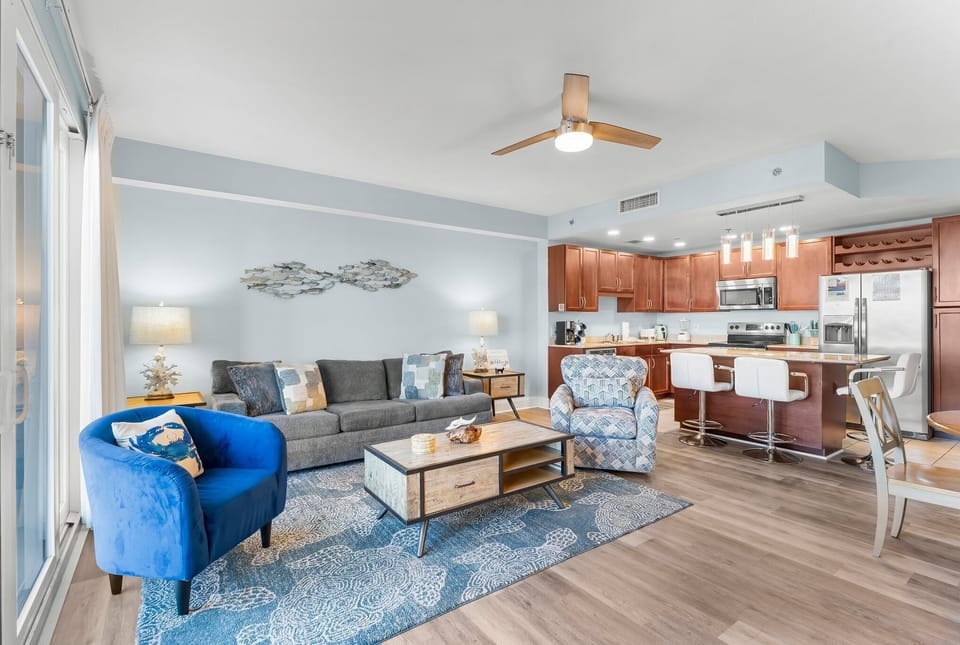 Open-concept living area with modern kitchen and comfortable seating.