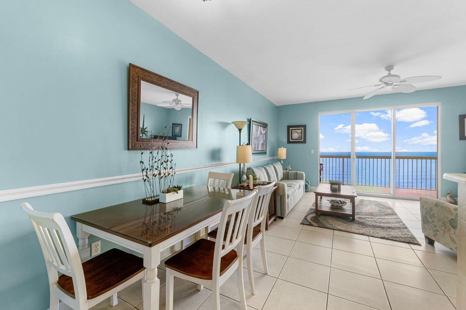 Relax in this coastal-style living and dining area with ocean views.