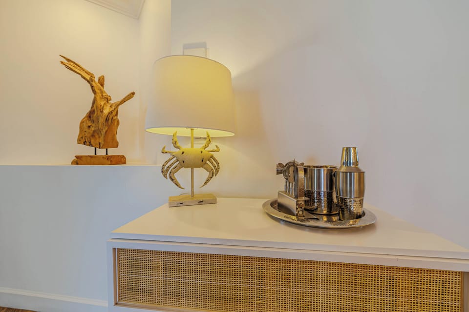 - Unwind with this beautifully curated bar nook, your vacation starts here
- Coastal charm meets modern elegance, creating the perfect ambiance for cocktails
- Shake up your favorite drinks & enjoy stylish, laid back style in your home away from home