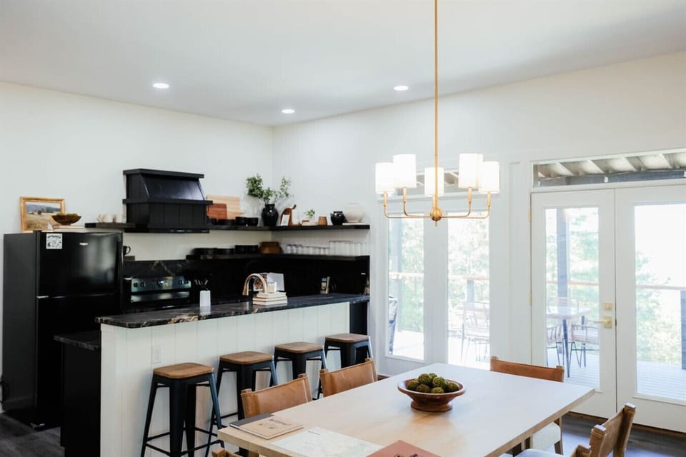 Gather around the dining table with a fully equipped kitchen just steps away