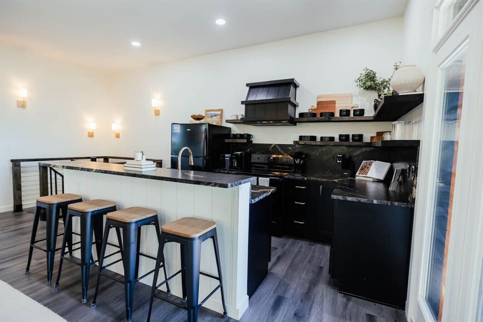 Bright, open-concept kitchen and dining area with easy access to the outdoor deck