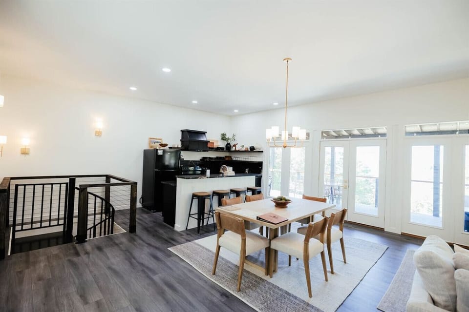 Gather around the dining table or enjoy casual seating at the breakfast bar
