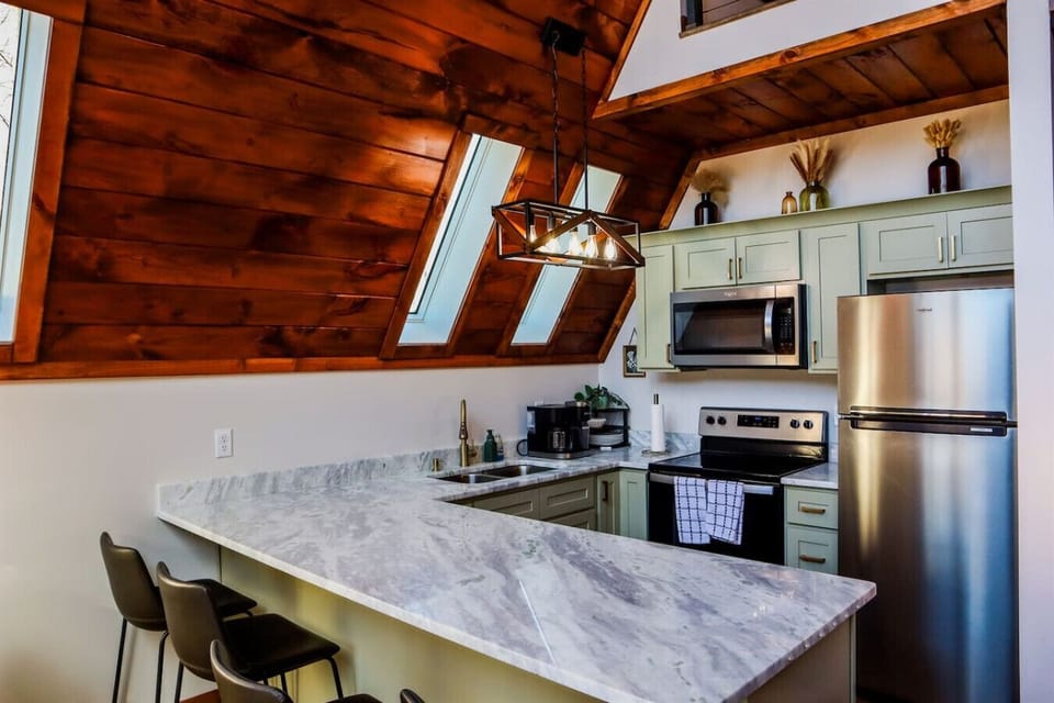 A fully equipped kitchen with bar seating makes cooking and gathering effortless
