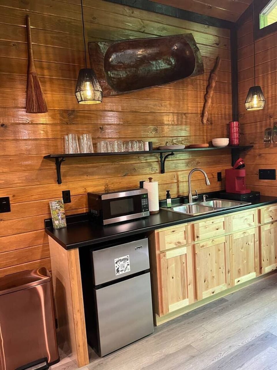 Cute kitchenette with mini fridge, microwave, toaster and Keurig coffee pot. Plates, bowls, cups, mugs and silverware provided.