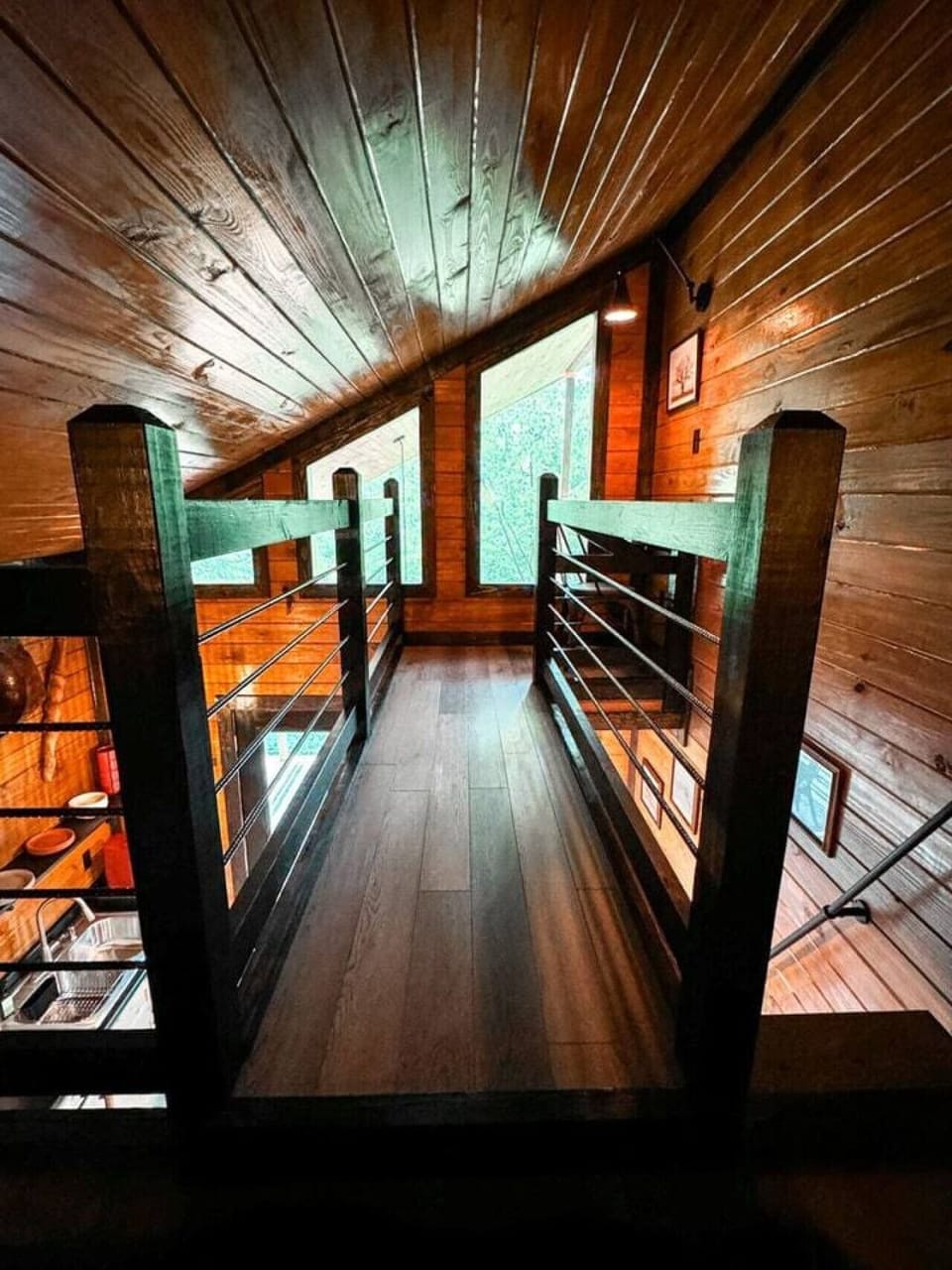 View of the office space from the bed across the catwalk