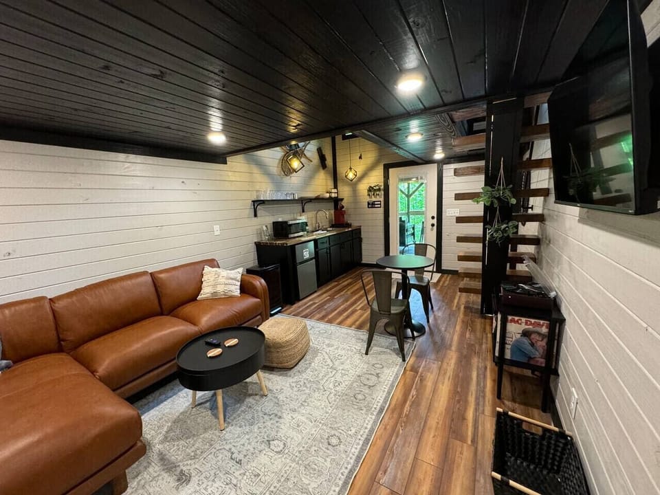 Cozy and compact living space provides a bistro table and full kitchenette to perfectly suit a party of two.