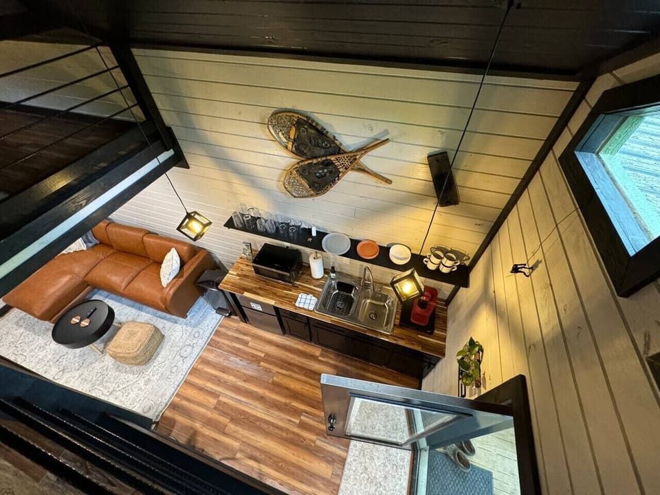 View of the kitchenette from the catwalk above that leads to the private workspace.