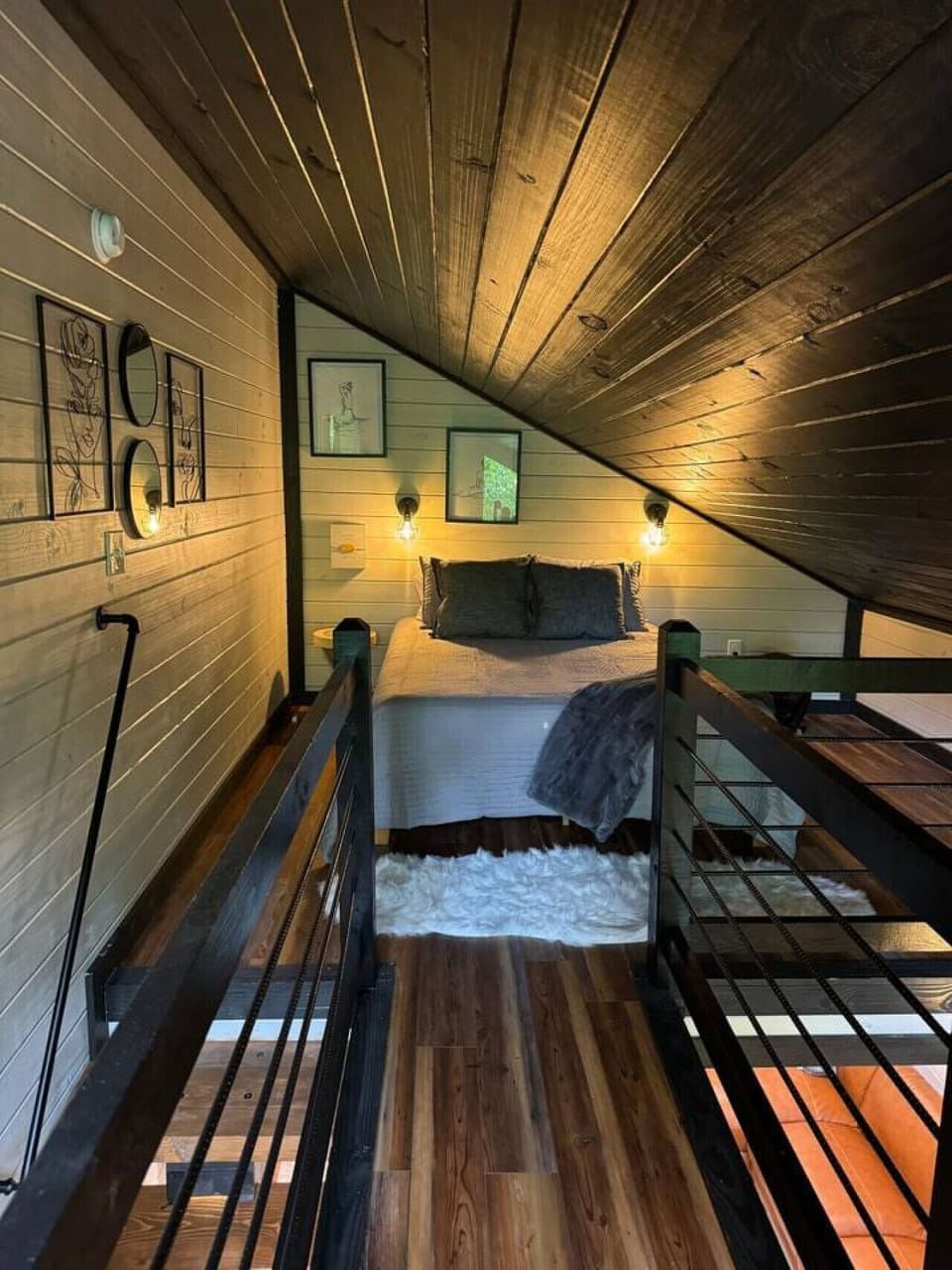 Plush queen bed as seen from the catwalk. Portable fan provided as well as extra blankets and pillows.