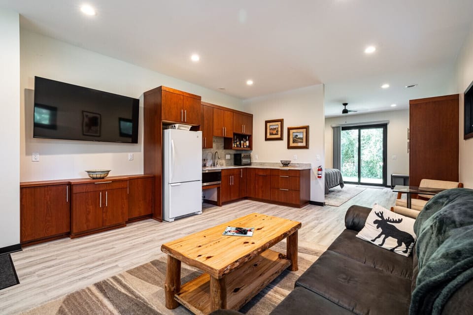 The 4th Bed & Bath is set up as a private suite on the first floor.  Bed, Bath, Kitchenette, living area, and patio.