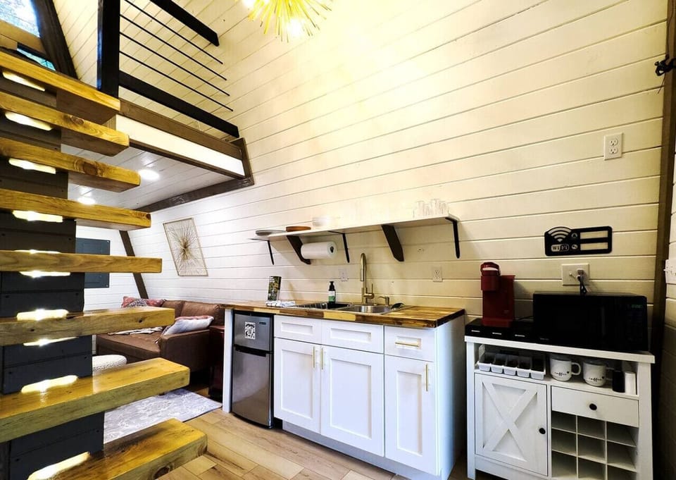 Well-equipped kitchenette with a coffee station, mini fridge, microwave, and everything you need for simple meals