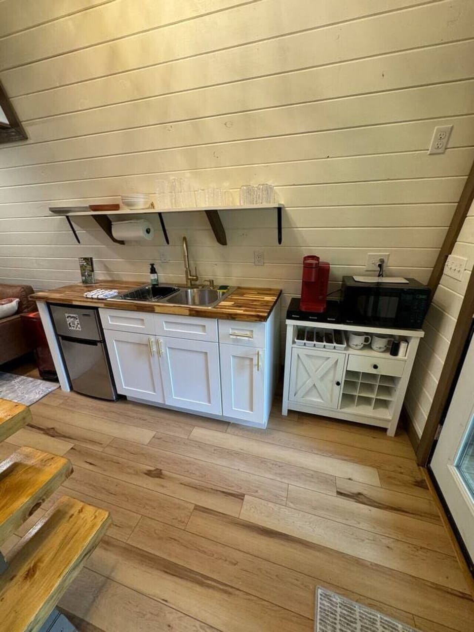 Kitchenette area provides mini fridge, toaster, microwave, Keurig coffee pot and all needed dishes. This includes bowls, plates, cups, mugs and silverware.