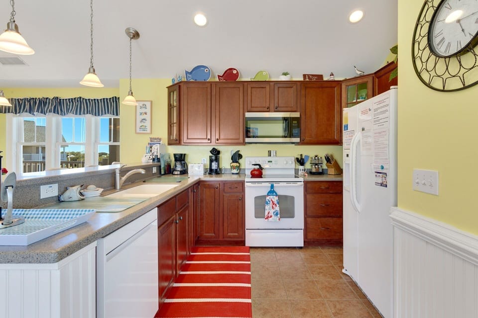 The fully equipped Kitchen with a Breakfast Bar makes meal preparation a breeze.
