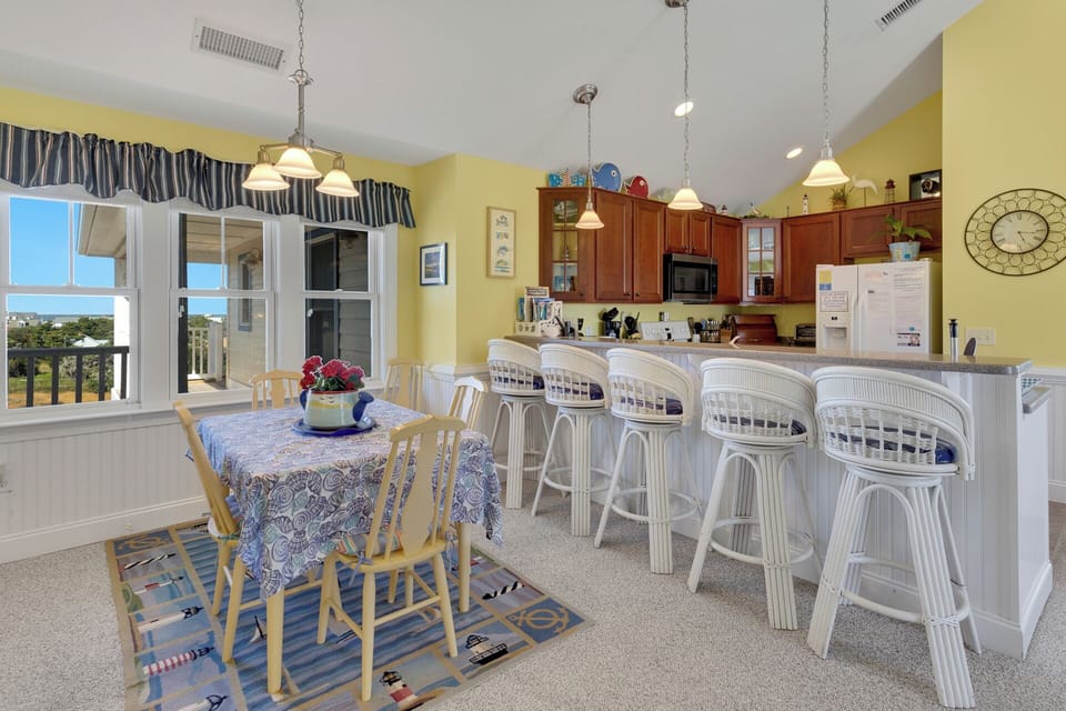 The open-concept Living and Dining Area is breezy and welcoming!