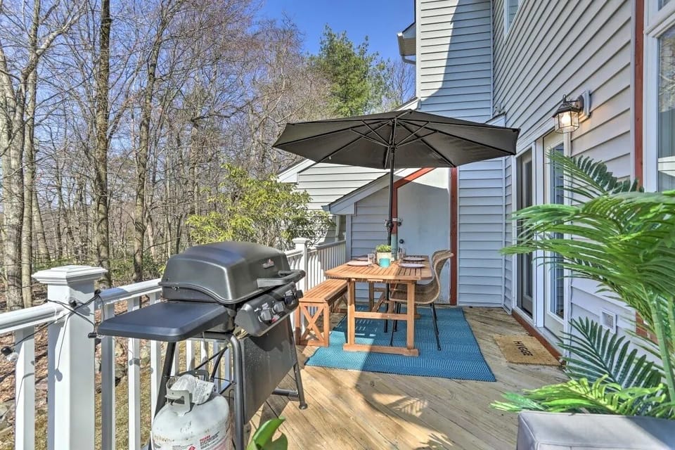 Private patio with grill, picnic table and outdoor sectional. 