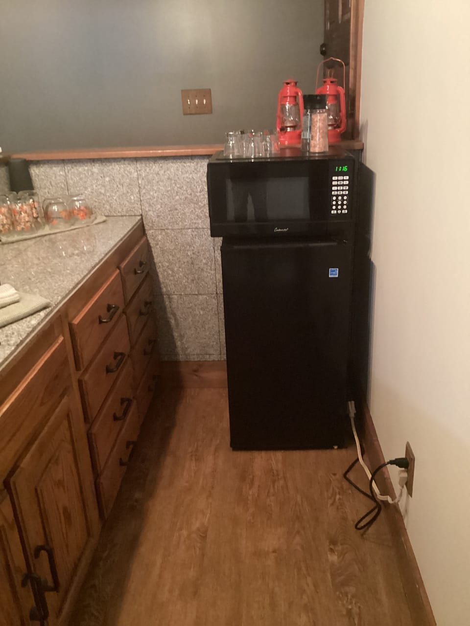 Kitchenette with refrigerator and microwave coffee station